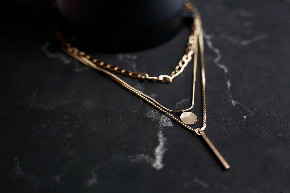 Gold layered coin and bar pendant necklace